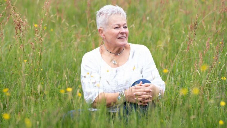 Jules Whale sat in the long grass