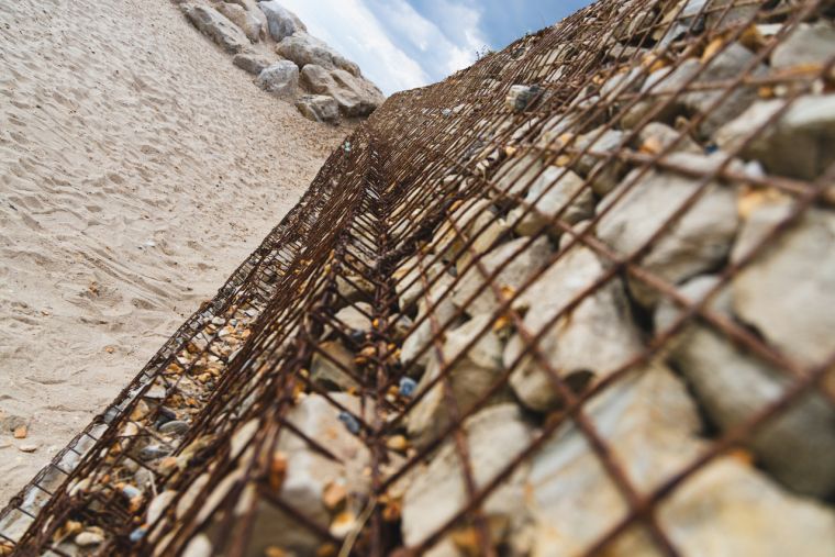 Wire cage of Dorset beach pebbles