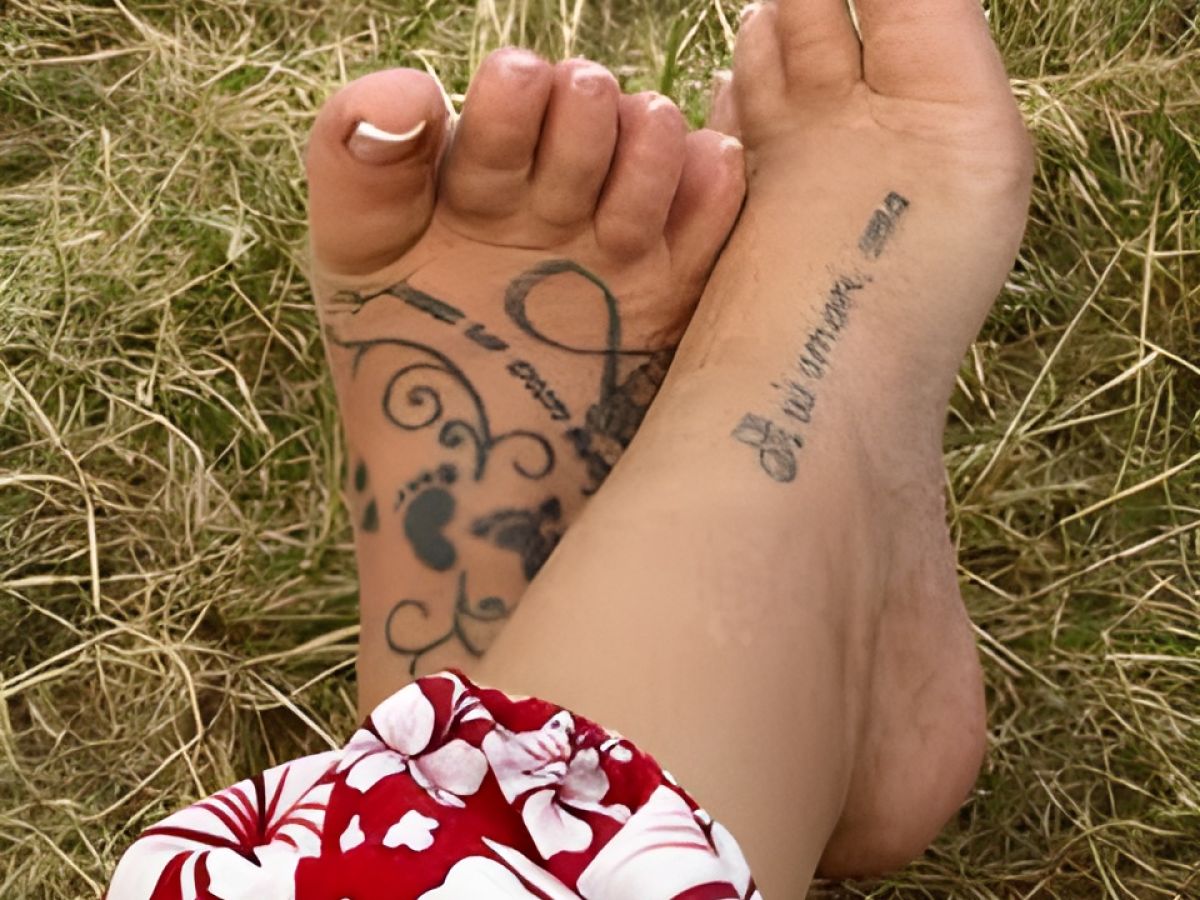 Image of some feet with tattoos relaxing.
