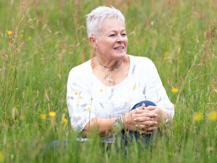 Jules Whale sat in the long grass